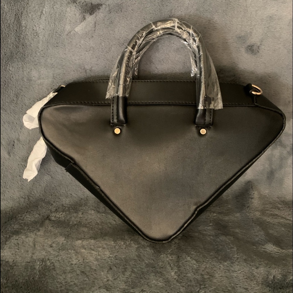 VShape leather look purse with addt’l strap.